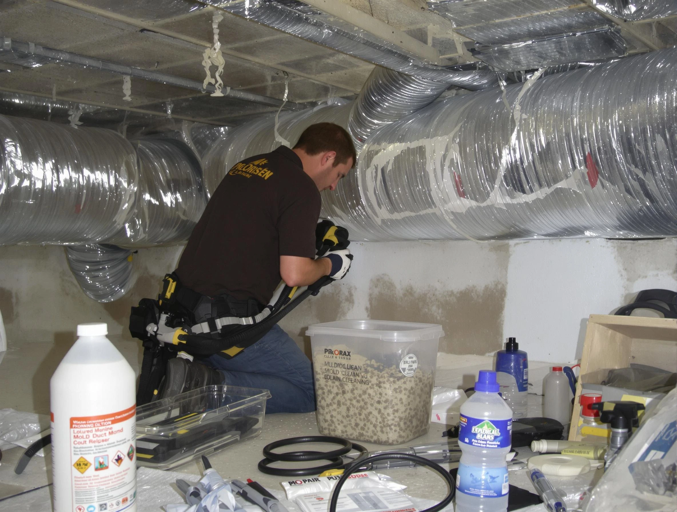 Dracut Air Duct Cleaning specialist performing professional mold removal from air ducts in Dracut